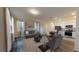 Open-concept living room with hardwood floors and modern decor at 6178 Daerr Ridge St, Zephyrhills, FL 33542
