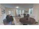 Open-concept living room with hardwood floors and natural light at 6178 Daerr Ridge St, Zephyrhills, FL 33542