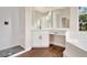 Bathroom with white tiled shower, vanity, large mirror, and a soaking tub at 11018 Pine Lilly Pl, Lakewood Ranch, FL 34202
