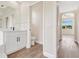 Bathroom featuring a vanity, toilet, and a view of the bedroom area through an archway at 11018 Pine Lilly Pl, Lakewood Ranch, FL 34202