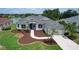 Charming single-Gathering home with well-manicured landscaping, a two-car garage, and a welcoming entrance at 11018 Pine Lilly Pl, Lakewood Ranch, FL 34202