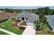 Desirable home boasts lush landscaping, a two-car garage, and close proximity to a serene lake at 11018 Pine Lilly Pl, Lakewood Ranch, FL 34202