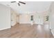 Bright and airy living room with hardwood floors, neutral paint, and an open layout at 11018 Pine Lilly Pl, Lakewood Ranch, FL 34202