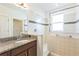Bathroom featuring a sink and a walk-in shower at 32717 Coldwater Creek Loop, Wesley Chapel, FL 33545