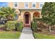 Inviting home entrance with manicured bushes and a well-maintained lawn at 32717 Coldwater Creek Loop, Wesley Chapel, FL 33545