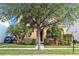 Lovely home exterior featuring lush landscaping and a welcoming entrance at 32717 Coldwater Creek Loop, Wesley Chapel, FL 33545