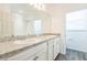 Bathroom with double vanity sinks, large mirror and walk-in shower at 5254 Suncatcher Dr, Wesley Chapel, FL 33545