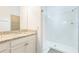 Bathroom featuring granite countertop vanity and a walk-in glass enclosed shower at 5254 Suncatcher Dr, Wesley Chapel, FL 33545