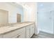 Bathroom boasts double sinks, granite countertops and a walk-in shower at 5254 Suncatcher Dr, Wesley Chapel, FL 33545