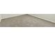 Close up of bedroom floor with light-gray carpet and white trim at 5254 Suncatcher Dr, Wesley Chapel, FL 33545