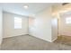 Upstairs bonus room with neutral walls and carpet is bright and spacious at 5254 Suncatcher Dr, Wesley Chapel, FL 33545