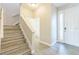 Home foyer featuring wood-look tile floors and a staircase at 5254 Suncatcher Dr, Wesley Chapel, FL 33545