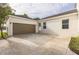 Large two car garage with an expansive driveway at 5254 Suncatcher Dr, Wesley Chapel, FL 33545