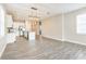 Bright kitchen featuring an island with a sink, stainless appliances, and white cabinetry at 5254 Suncatcher Dr, Wesley Chapel, FL 33545