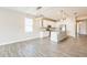 Modern kitchen features white cabinets, stainless steel appliances, and an island with a granite countertop at 5254 Suncatcher Dr, Wesley Chapel, FL 33545
