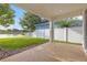 Covered patio offers outdoor living space with a serene view of the lake at 5254 Suncatcher Dr, Wesley Chapel, FL 33545