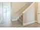 Home staircase featuring wooden floors and a white handrail at 5254 Suncatcher Dr, Wesley Chapel, FL 33545