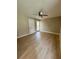 Spacious bedroom featuring wood-look flooring and a ceiling fan at 7310 Sunshine Skyway S Ln # 116, St Petersburg, FL 33711