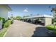 Convenient carport parking with ample spaces, providing shaded protection for vehicles in a community setting at 7310 Sunshine Skyway S Ln # 116, St Petersburg, FL 33711