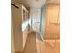 Bright walk-in closet featuring custom shelving and drawers and bathroom access at 7310 Sunshine Skyway S Ln # 116, St Petersburg, FL 33711