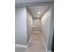 Walk-in closet featuring bright lighting and metal shelving units at 7310 Sunshine Skyway S Ln # 116, St Petersburg, FL 33711