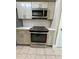 Updated kitchen featuring stainless steel oven and white countertops at 7310 Sunshine Skyway S Ln # 116, St Petersburg, FL 33711