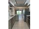 Open concept kitchen with updated countertops and stainless steel appliances at 7310 Sunshine Skyway S Ln # 116, St Petersburg, FL 33711