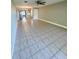 Open concept living room and kitchen, featuring ceramic tile floors at 7310 Sunshine Skyway S Ln # 116, St Petersburg, FL 33711