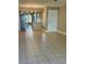 Open concept living room and kitchen, featuring ceramic tile floors at 7310 Sunshine Skyway S Ln # 116, St Petersburg, FL 33711