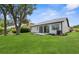 Large backyard featuring a well-manicured lawn and patio at 9555 Knightsbridge Cir, Sarasota, FL 34238
