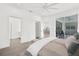 Open main bedroom with an en-suite bathroom and access to a screened patio at 9555 Knightsbridge Cir, Sarasota, FL 34238