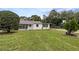 Cozy single-story home with a tidy front garden and convenient carport at 103 4Th Nw Ave, Lutz, FL 33548