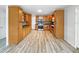 Spacious kitchen with custom wood cabinetry, stainless steel appliances, and tile backsplash at 103 4Th Nw Ave, Lutz, FL 33548