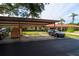 Community carport offering covered parking spaces for residents and guests at 1122 Montrose Pl # 1713, Dunedin, FL 34698