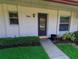 Inviting front entrance with well-manicured landscaping and a clearly marked house number at 1122 Montrose Pl # 1713, Dunedin, FL 34698