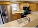 Kitchen featuring stainless steel appliances and ample counter space at 1122 Montrose Pl # 1713, Dunedin, FL 34698