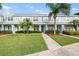 Charming townhome with lush green lawn and beautiful landscaping at 11622 Colony Lake Dr, Tampa, FL 33635