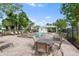 Community pool with lounge chairs and shaded seating area at 11622 Colony Lake Dr, Tampa, FL 33635