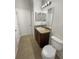 Bathroom with a vanity, granite countertop, tile flooring, and toilet at 37601 Georgina Ter, Zephyrhills, FL 33542
