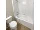 Standard bathroom features a clean white tub, shower, and tiled floor at 37601 Georgina Ter, Zephyrhills, FL 33542