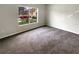 Bedroom features a large window offering great views of the front yard at 37601 Georgina Ter, Zephyrhills, FL 33542