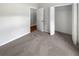 A spacious bedroom with neutral colors and a large closet offers comfort and style at 37601 Georgina Ter, Zephyrhills, FL 33542