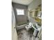 Bathroom showing tub, toilet and sink with natural light, ready for a full renovation and upgrade at 5026 Osprey Ln, New Port Richey, FL 34652