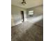 A modest bedroom featuring a window and a closet, presenting a canvas ready for personalization and renovation at 5026 Osprey Ln, New Port Richey, FL 34652