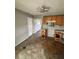 An unfinished kitchen area with existing cabinets, offering an opportunity for a full renovation at 5026 Osprey Ln, New Port Richey, FL 34652