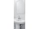 Simple bathroom with pedestal sink and square mirror at 7292 Deer Valley Circle, Tampa, FL 33635