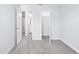 Carpeted bedroom with open doors at 7292 Deer Valley Circle, Tampa, FL 33635