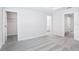 Bright, empty bedroom with carpet and multiple entry doors at 7292 Deer Valley Circle, Tampa, FL 33635