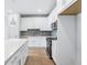 Contemporary kitchen featuring an island and stainless steel appliances at 7292 Deer Valley Circle, Tampa, FL 33635