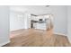 Open-concept living space with a kitchen featuring white cabinets, stainless steel appliances, and tile flooring at 7292 Deer Valley Circle, Tampa, FL 33635